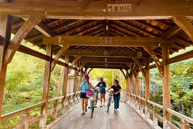 Pedal Adventure Kyoto's iconic landmarks on an e-bike tour - Bikes, helmets, safety signals, and that comfortable group pace